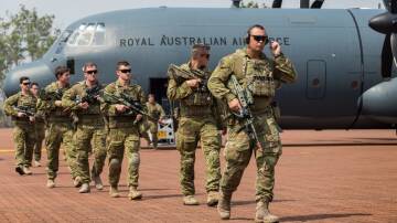 Australian Army Soldiers from 1st Battalion, Royal Australian Regiment exit a No 37 Squadron C-130J Hercules after arriving at RAAF Base Scherger in 2017. Picture: Department of Defence