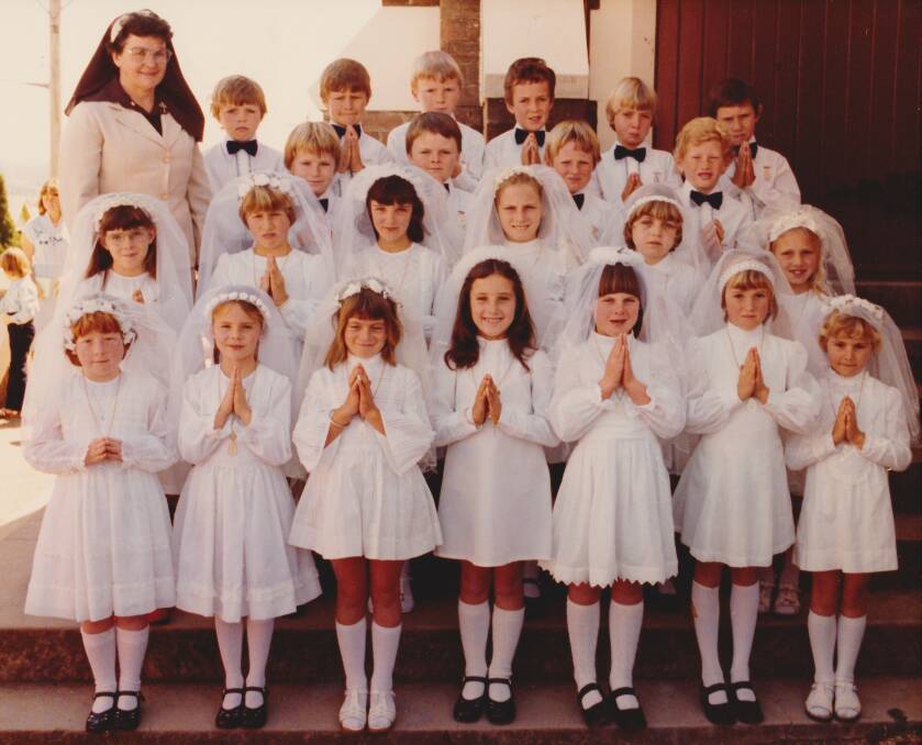 Sister Margaret and the 1980 class: This wasn't the school uniform but their first communion, a significant celebration. 