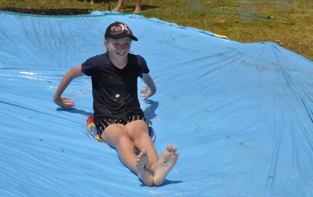 Goulburn East Public School Year 5/6 student, Lexie Price, tested out the water slide as part of the SurFebruary fundraising.