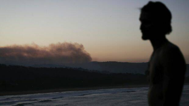 Tathra resident Clint Morehead stayed back in Tathra during the bushfire the previous night. Photo: Alex Ellinghausen
