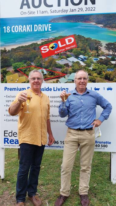 SOLD: Andrew Henderson and his brother Grant celebrate the sale of their family's Pambula Beach home on Saturday, for what is believed to be a record amount.