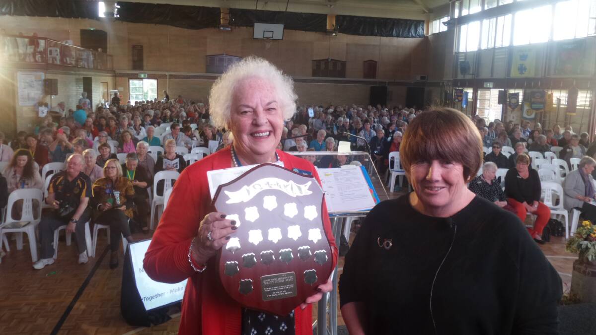 Jan Humphreys receives her award from state president Annette Turner from White Cliffs Branch, at the conference.