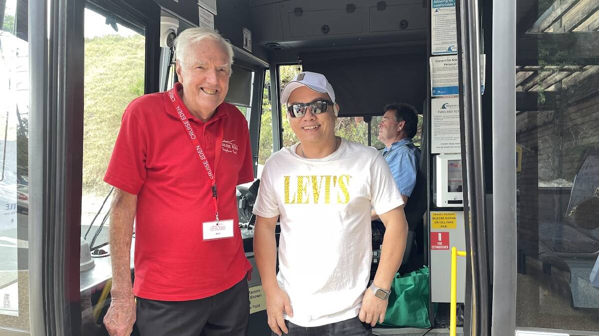 Cruise Eden volunteer Bob Westmacott with a visitor on the Eden shuttle bus at Eden Wharf. Picture by Denise Dion