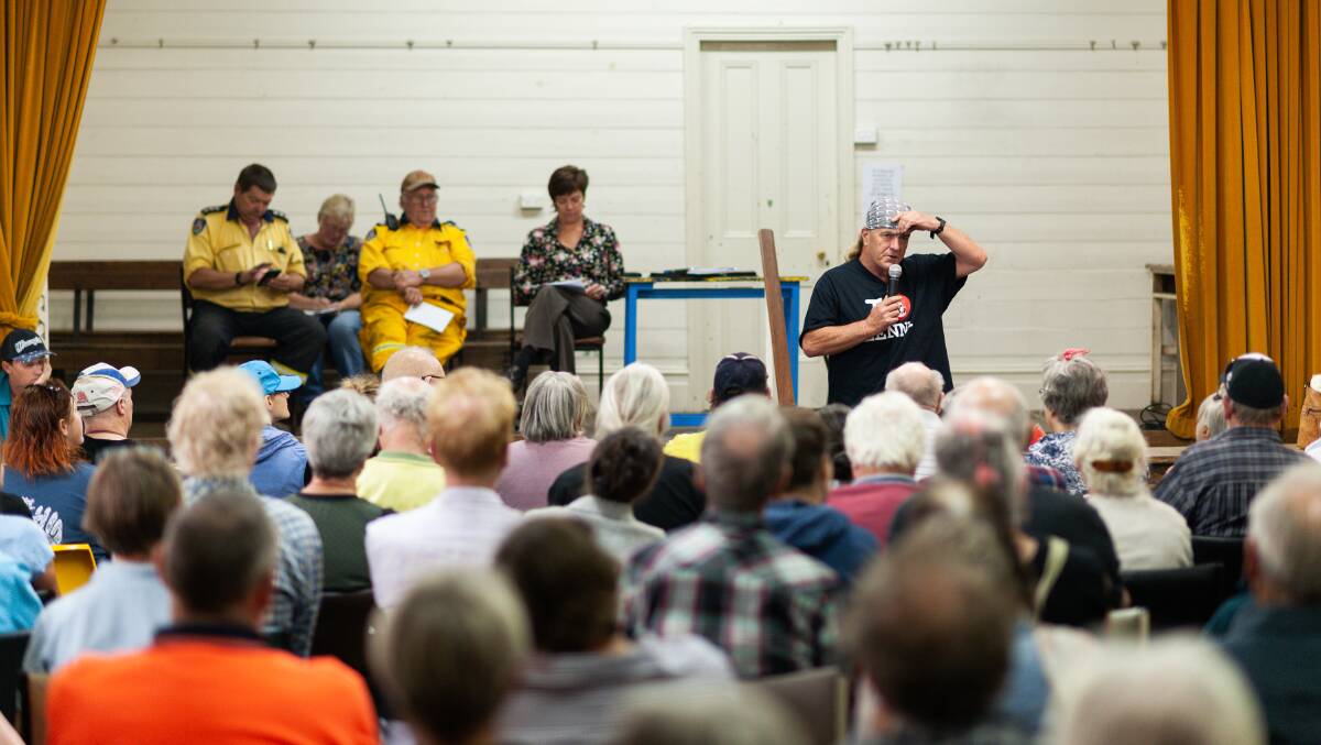 Chris "Doss" O'Sullivan (right) starts the town hall meeting he organised for January 2. Photo: Michael Weinhardt