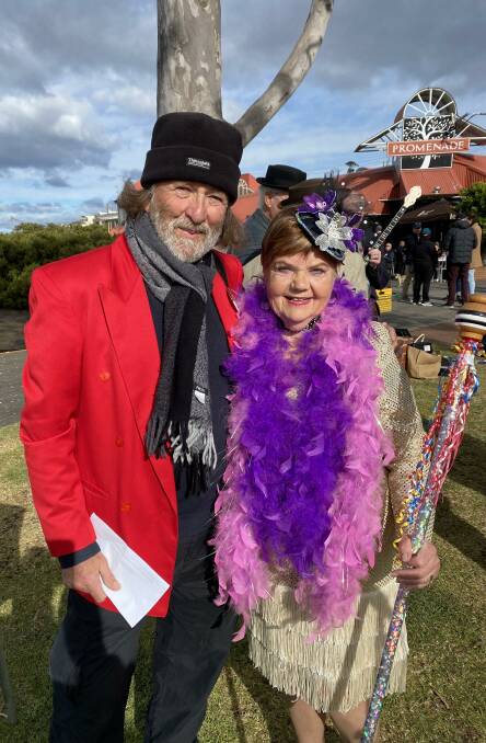 Acting president of the Merimbula Jazz Festival Paul Dion with Joyce McGill of Tura Beach who was awarded first prize for her outfit in the parade.