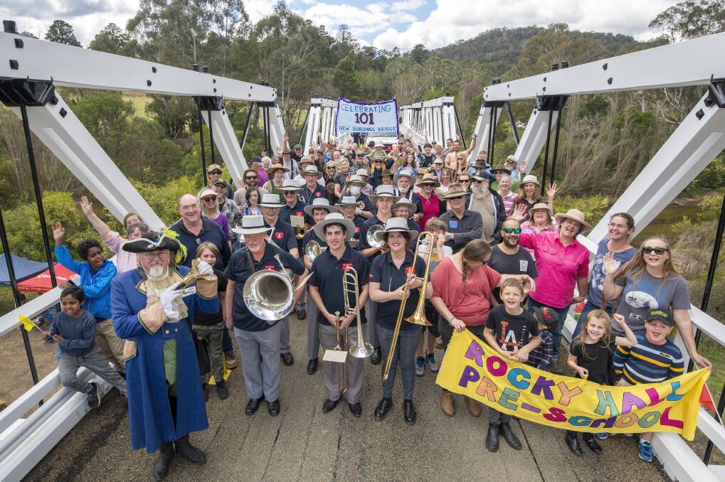 A community celebrates with music and a march across New Buildings Bridge for its 101st birthday. Picture by Brent Occleshaw