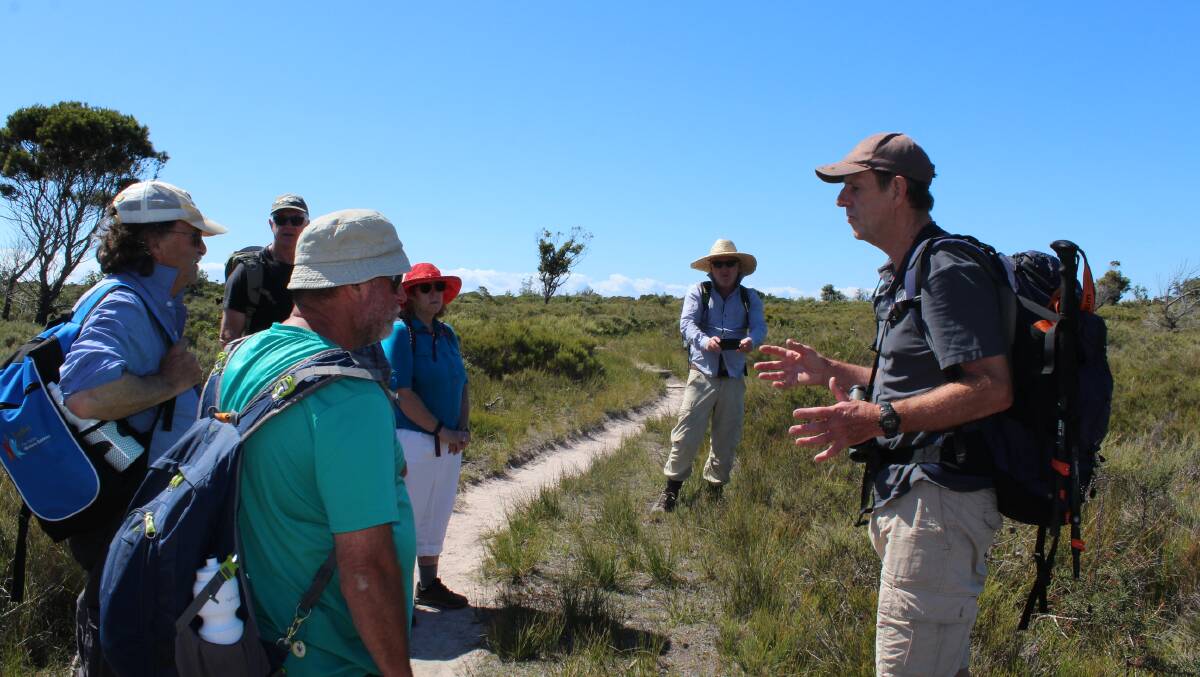 A stop on heathland as Tim Shepherd talks about the environment.