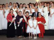 2022 Friday Night Eden Combined Churches debutantes and organisers, Anne Flint, Ruth Fletcher, Flo Young, Dave Boulton and Pam Inwood with flower girls, Stella Collins and Grace Armfield.  