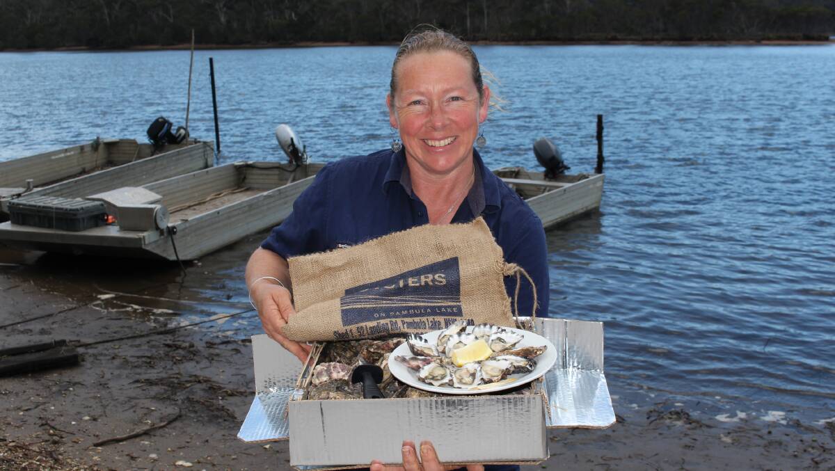 Sue McIntyre of Broadwater Oysters shows off some of their award-winning opened and unopened oysters from Pambula Lake. Photo: Denise Dion