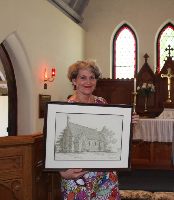 Of the church, in the church: Robyn Carmichael with one of three prints by Shirley Hannan at Holy Trinity Church, Kameruka on Saturday.