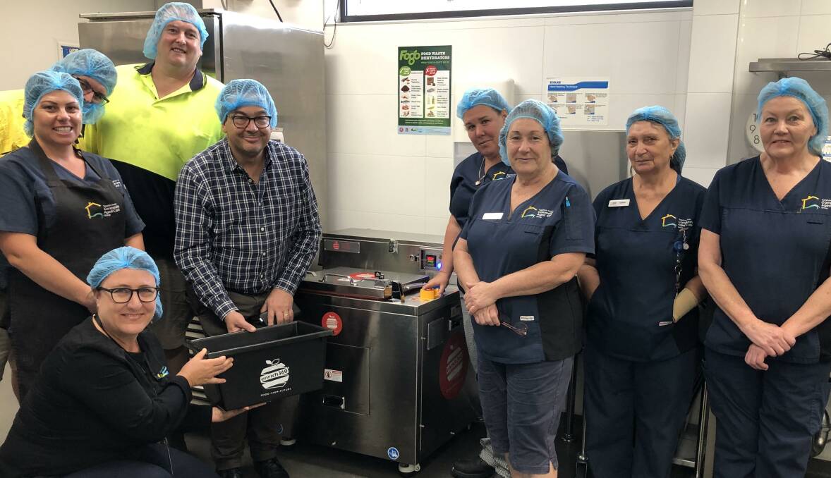 Staff at Hillgrove House being trained at the start of the trial last year, on how to use the new food dehydrators by enrich360 CEO Dean Turner, with BVSC waste project officer Rechelle Fisher.