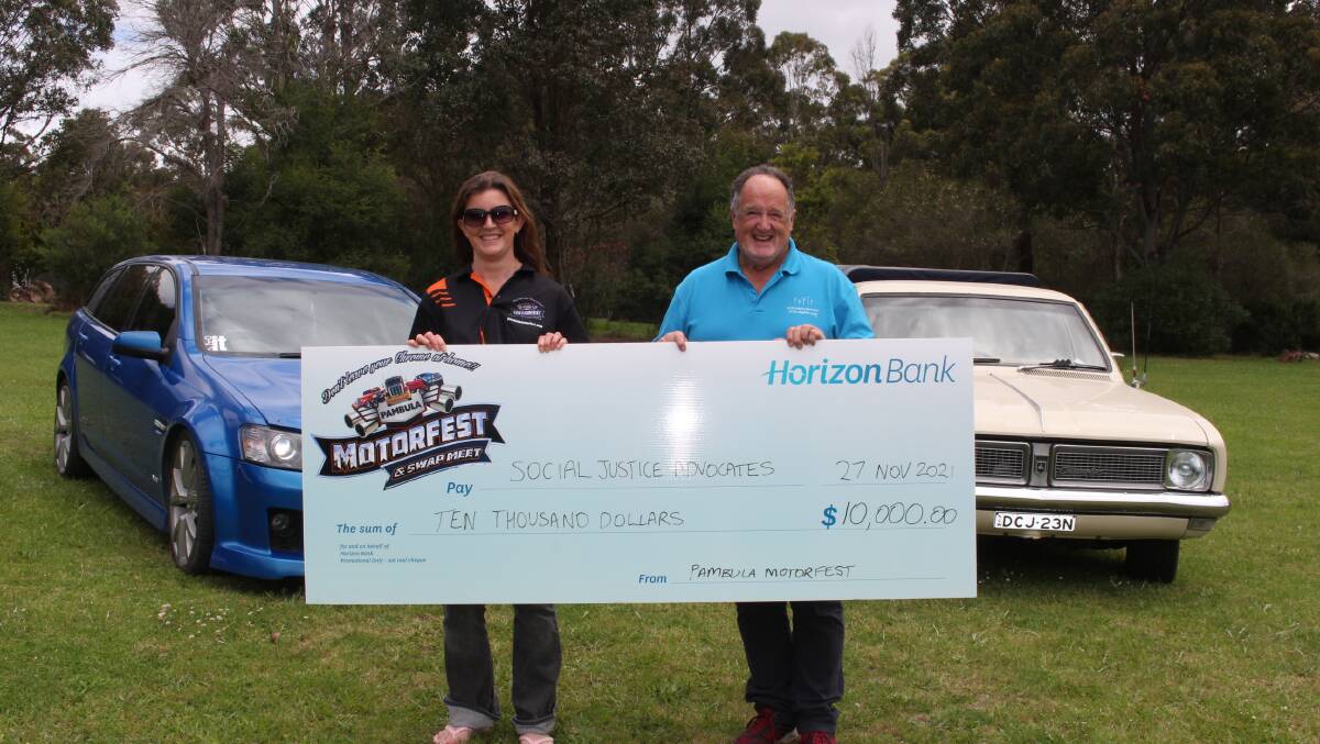 President of Pambula Motorfest Jessica Porter and Gavin Bell from the Social Justice Advocates of the Sapphire Coast and a little reminder of what Motorfest is all about with Scott Whatman's 1969 HT Holden ute (it has a Chevrolet engine) back right.