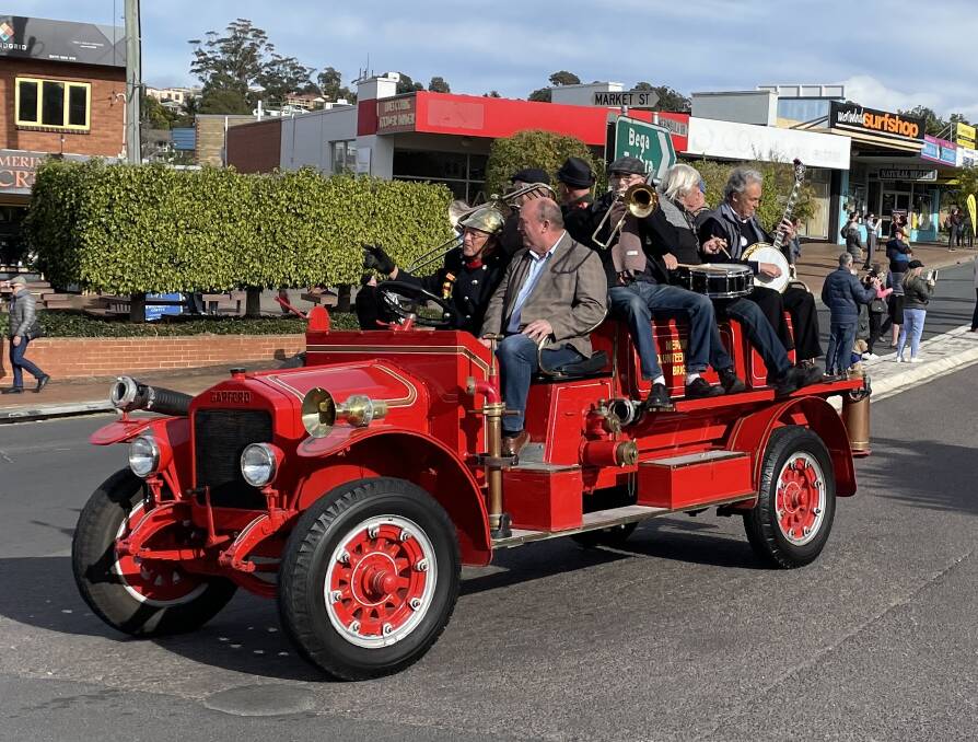 The vintage fire truck driven by Col Hazel with the mayor, Russell Fitzpatrick and musicians at the start of the parade.