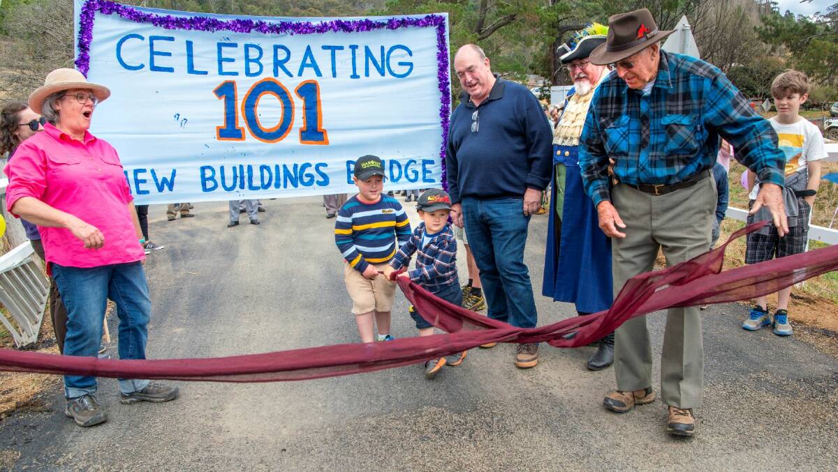 A ribbon was untied by the oldest person who had grown up in Rocky Hall, Maurie Whitby and the youngest current residents Elijah and Noah Mebane. Picture by Brent Occleshaw