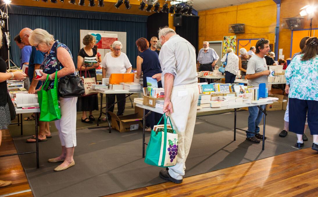 The book shop atmosphere at the Tathra Public School hall. Book lovers were encouraged to fill up on as many books as they could possibly carry. Photo: Rachel Mounsey