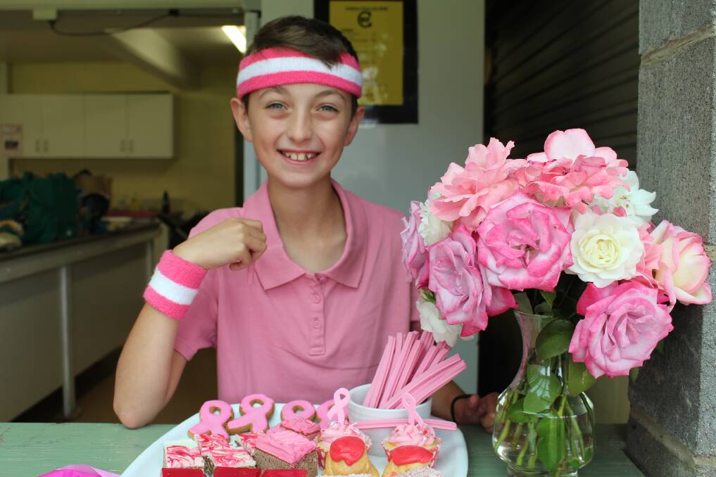 Dane Parks, sporting pink a head band and sweat bands, managed to keep dry at the "Pink Stumps" fundraiser held at Wolumla on Saturday.  