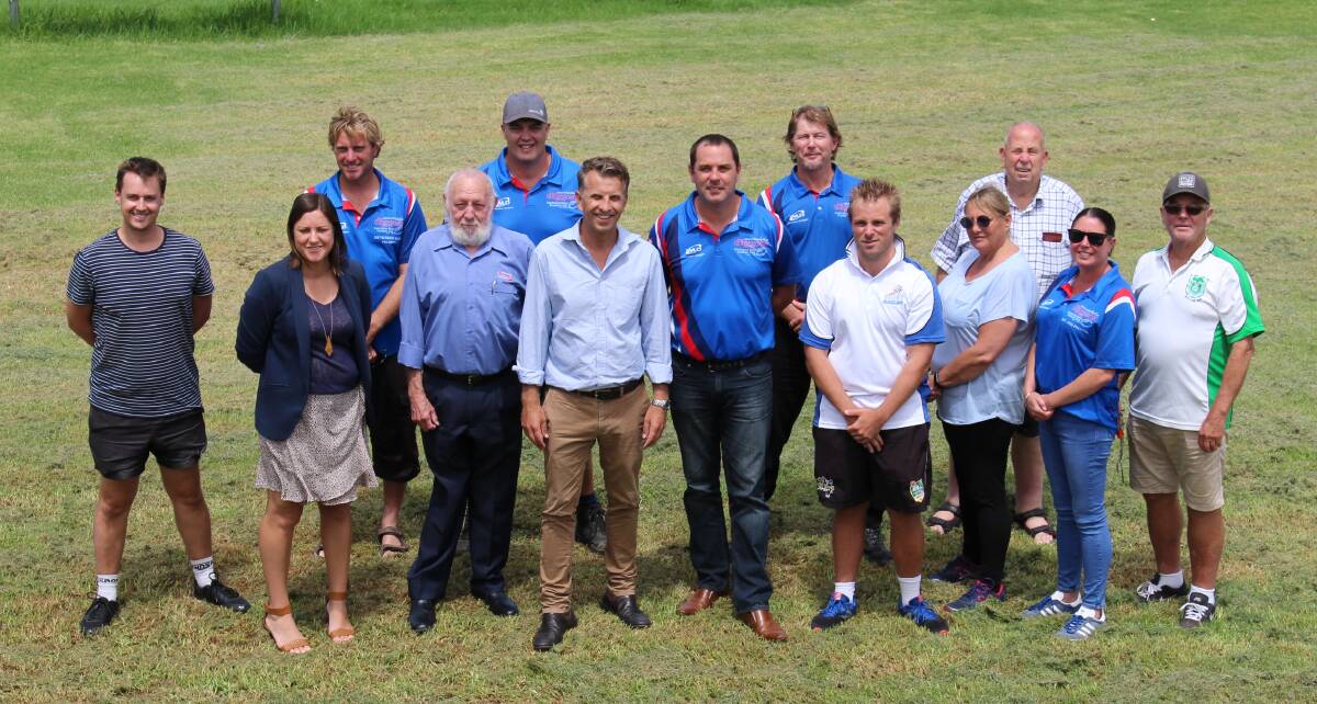 MP Andrew Constance (centre) alongside  (R) Merimbula Diggers Aussie Rules Football Club president Jason Raeck and secretary (L) Geoff King with Mayor Kristy McBain, Deputy Mayor Mitch Nadin and members of the Diggers, Far South Coast Cricket Association Charles Aggenbach and (far right)  Kim Martyn from Grasshoppers Soccer Club.   