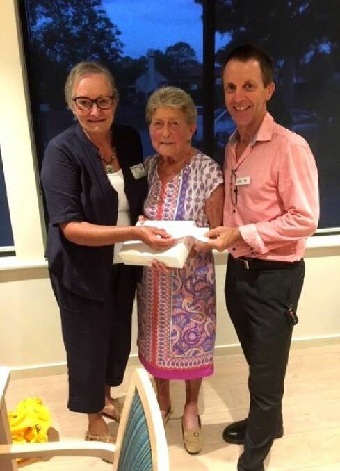 WELCOME DONATION: Bega Rotary president Marg Taylor presents resident Pat Avis and Sapphire Coast Community Aged Care CEO Matt Sierp with four iPads and keyboards. 