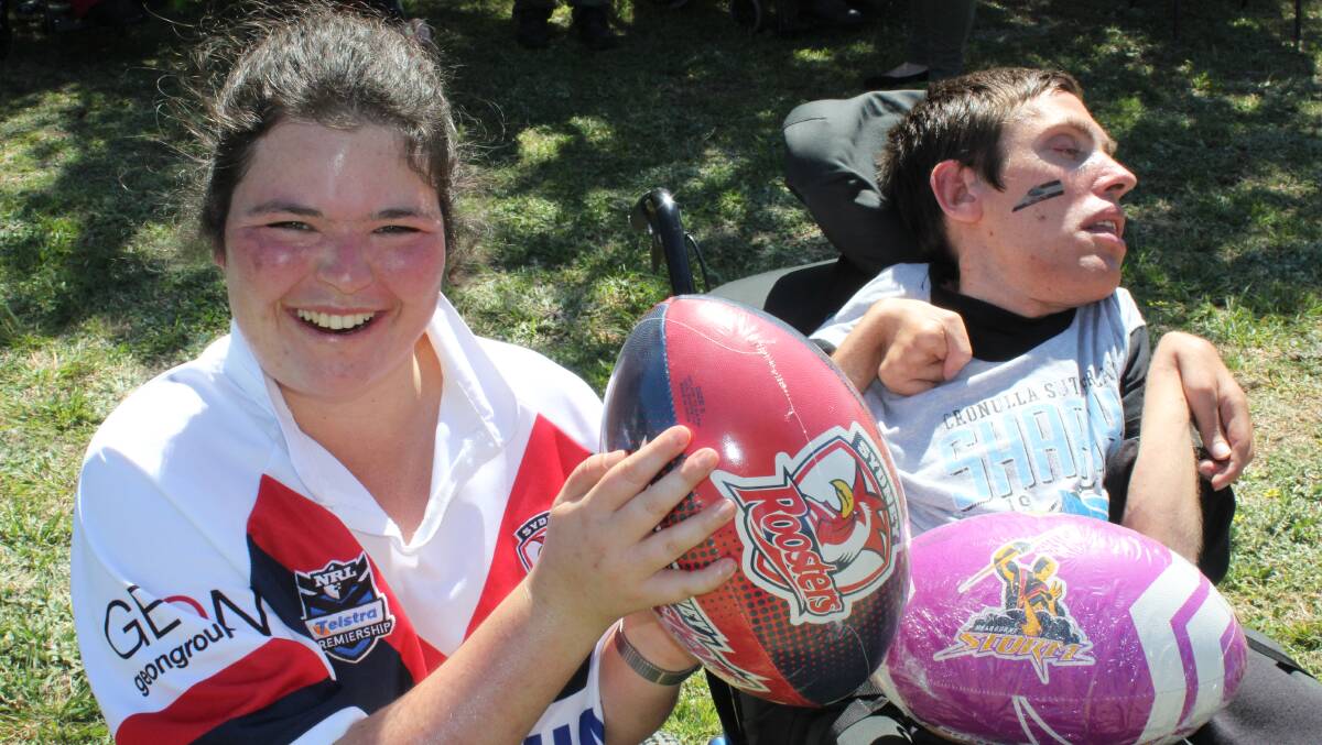 BEAMING SMILES: Taylor Kearny and James Cosis won the footballs in a raffle at Tulgeen's Footy Colours Day. 