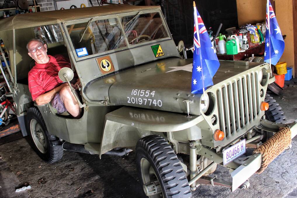 READY FOR THE ROAD: Bega's Bill Flood sits in his World War 2-era jeep which will be driven on Anzac Day by his twin brother Bob. 