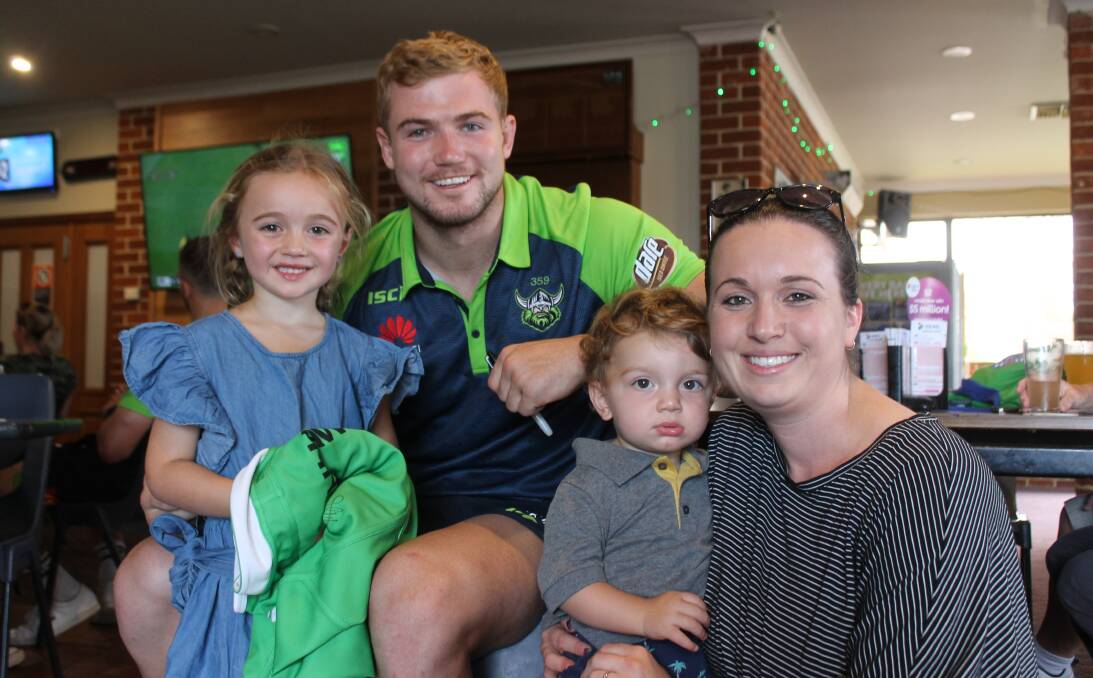 BIG FANS: Isabelle and Bailey Loth and Sarah Cefai of Coolagolite say hello to Canberra Raiders second rower Hudson Young at the Cobargo Hotel. 