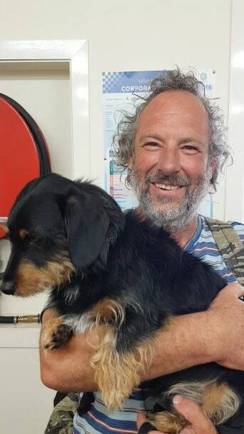 The man and Chewy after being rescued on Thursday. Image: NSW Police 