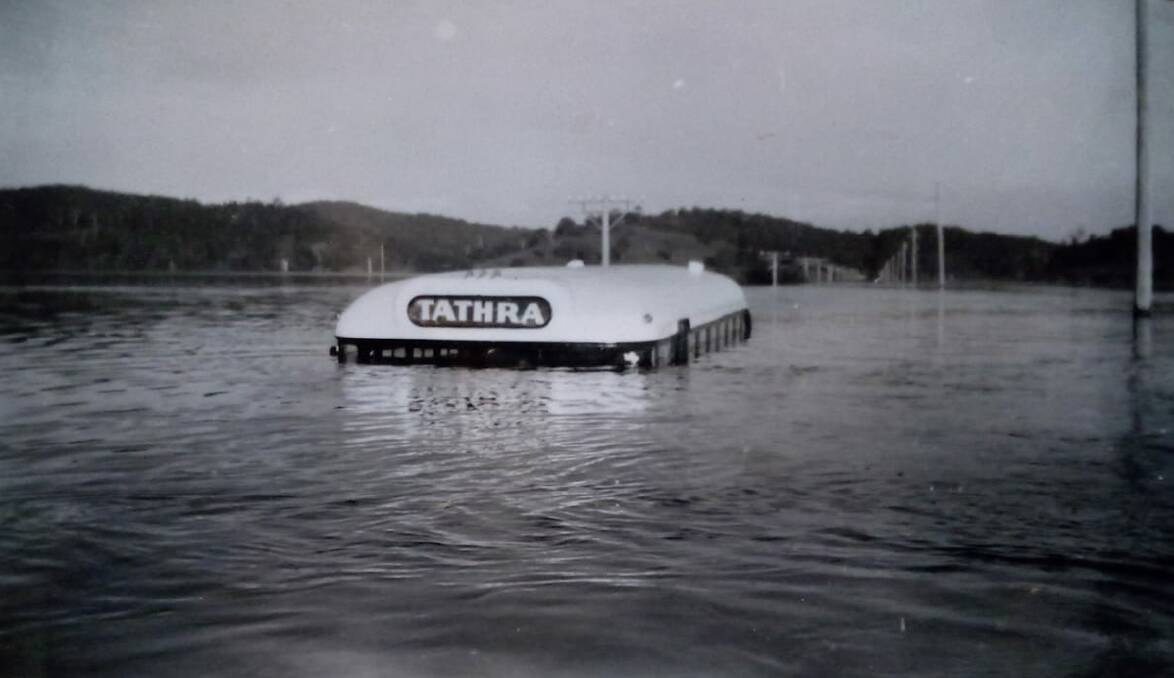 IN THE PAST: A historic photo of a Tathra bus caught in the Jellat Jellat flood in 1960. Picture courtesy of the late Rex Holgate
