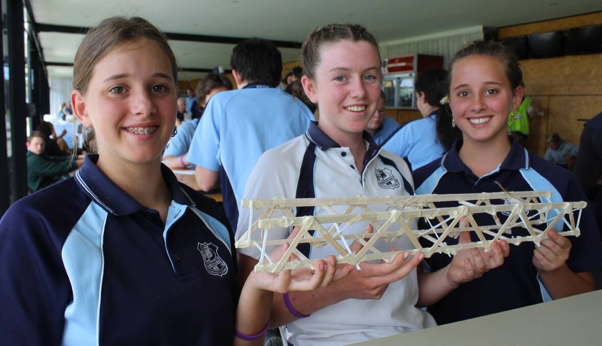 Eden Marine High School Year 9 students Niamh Occleshaw, Ffion Roberts-Thompson and Freya Occleshaw construct a bridge. 