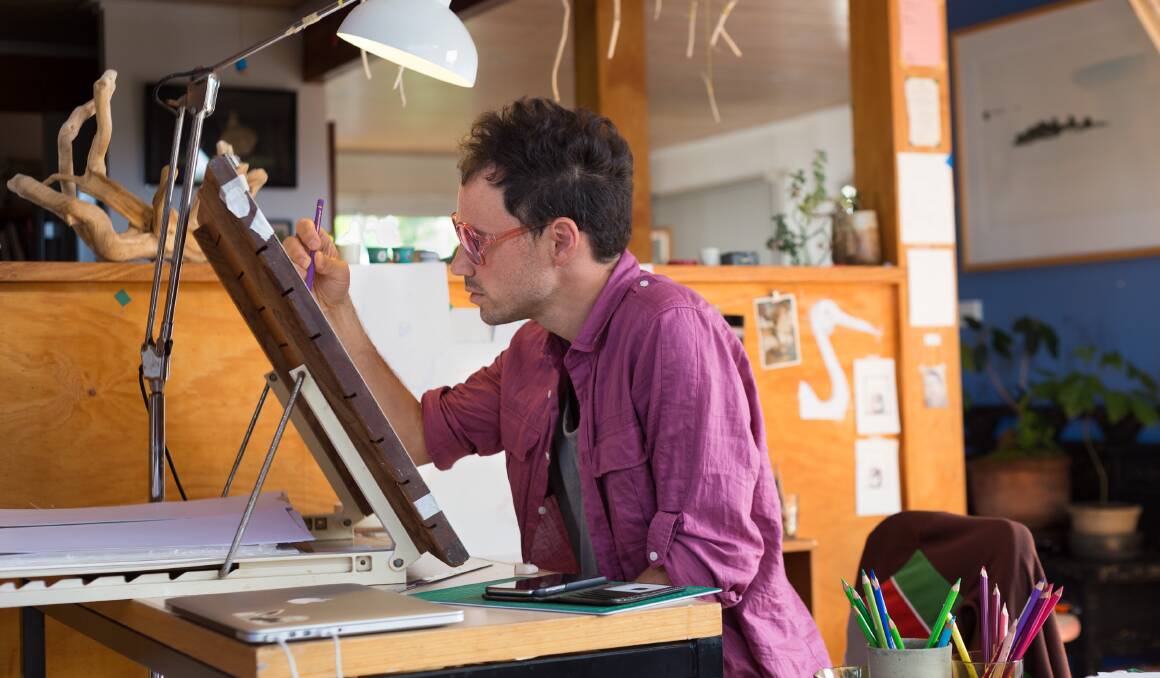 Matt Chun works on an illustration in his Bermagui studio. Picture: JB Knibbs