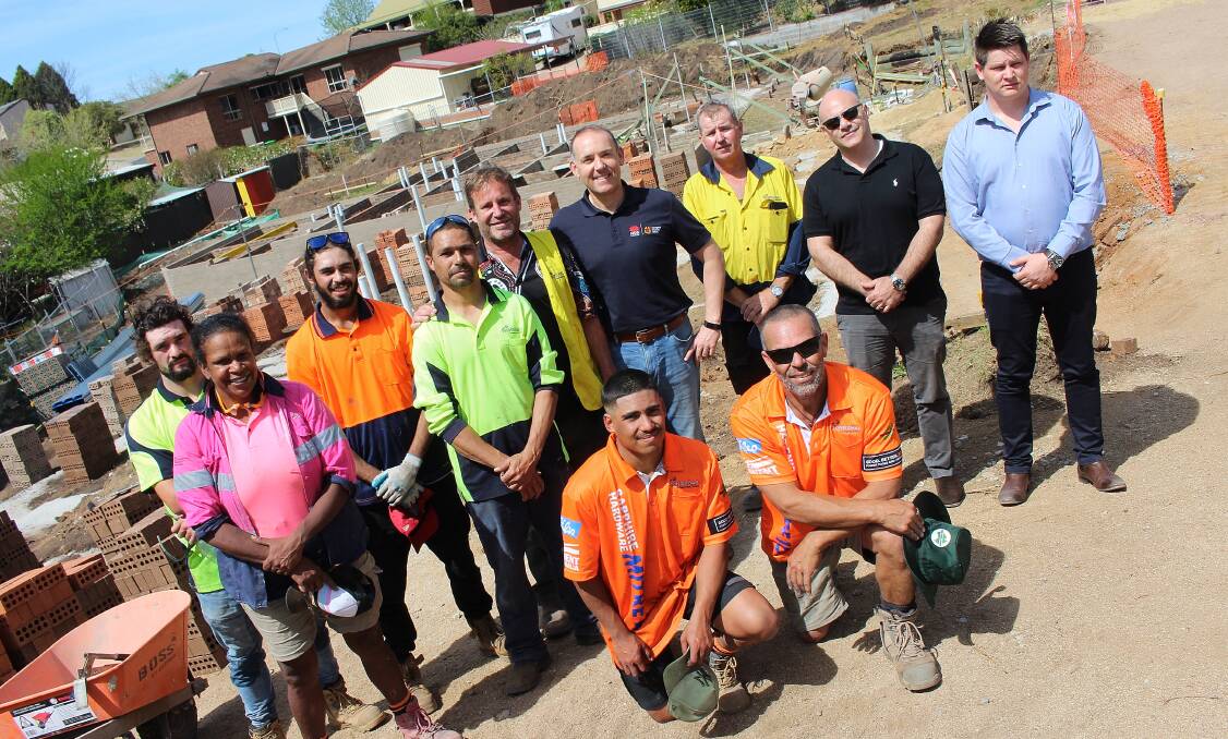 WORKING AS A TEAM: Members of Mundabaa Constructions and the Aboriginal Housing Office on site in Bega are Bobby Maher, Bronwyn Luff, Shane Moore, Dennis Arvidson, Chris Bird, Jeremiah Bamblett, Simon Newport, Drew Smeath, Pete Ahmat, Naef Qassis and Gavin Evans. 