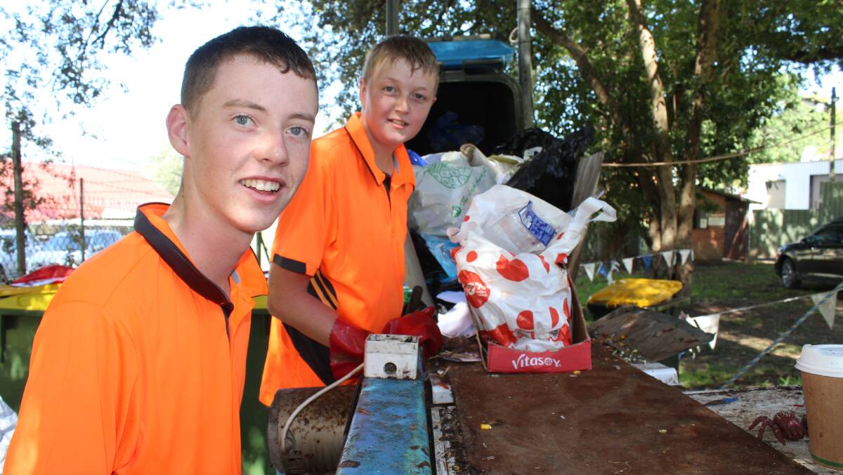 1st Cobargo Scouts Luke Meyers and Brodie Rixon sort out waste on the conveyor belt. 