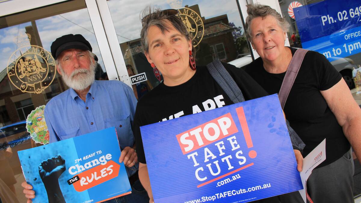 STANDING UP: Attending a protest on Wednesday calling for millions to be invested into Bega's current TAFE campus instead of a new one are Kim Hitchcock of Bega (centre) and her parents Arthur and Fay from Cooma.  