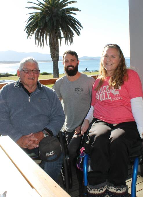 NICE DAY OUT: Ron Finneran, Yannis Gantner and Sue Thomas enjoy the view from the deck of the Bermagui Beach Hotel, which is wheelchair-friendly. 