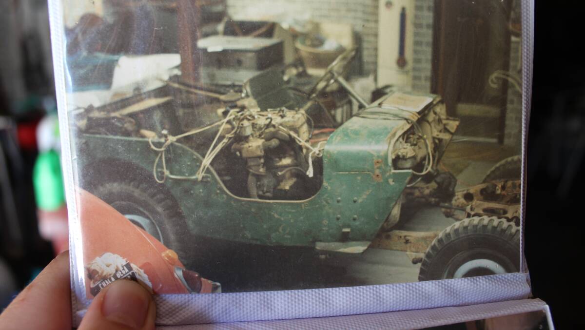A picture of taken during the restoration process of the motor sitting on the front seat. 