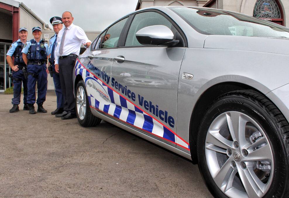 ROAD READY: Acting Sergeant Dave Kelly, Sergeant Jo Mayer, Chief Inspector Peter Volf and Bega Valley Motors director Greg Brabham stand next to the new Commodore.  
