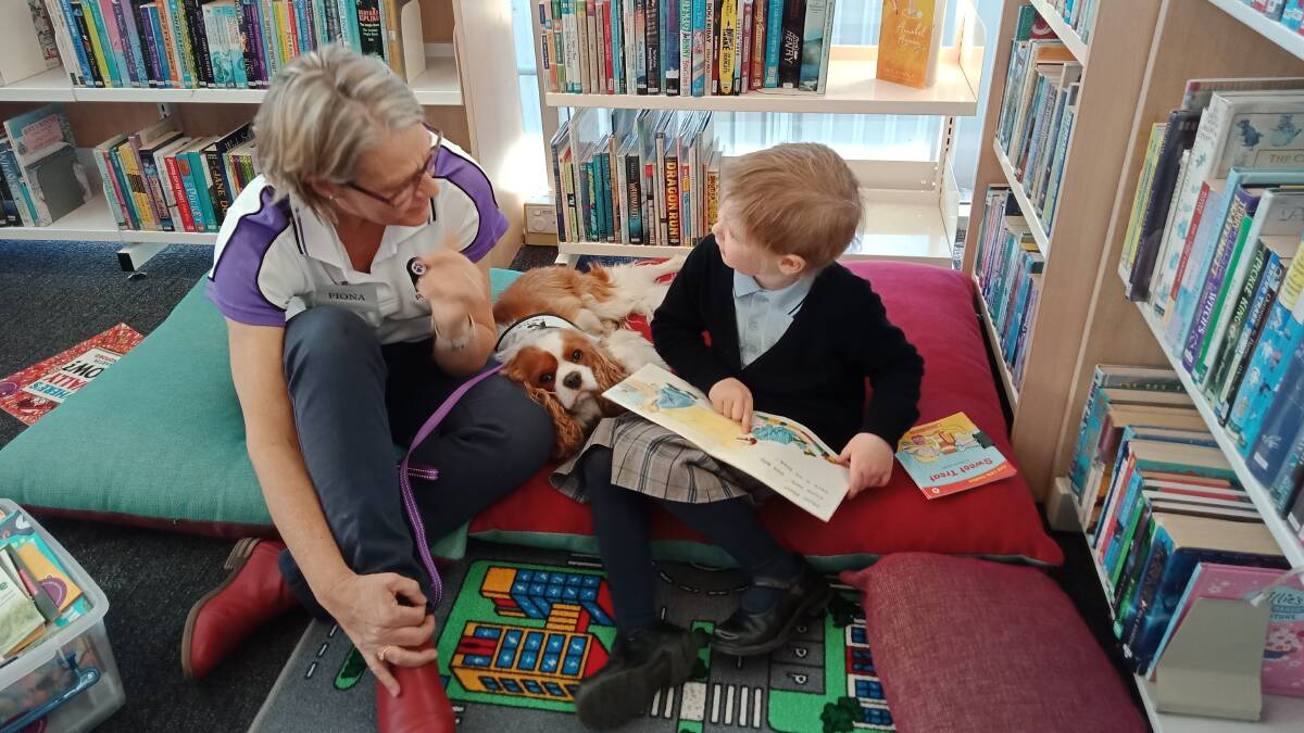 Participants of the Paws n Tales program at Bowral Library, photo courtesy of Wingecarribee Shire Council. 