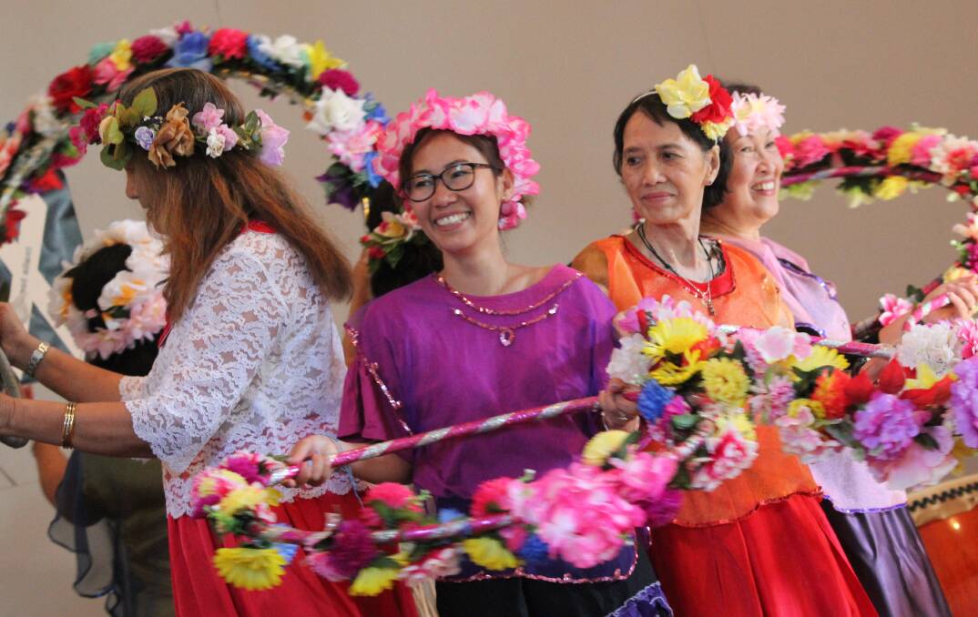 WELCOME: Filipino women, including Eva Porter of Tathra, Nita Gonzales of Bournda and Frances Clear of Tura Beach, perform a welcome dance at the Sapphire Coast Multicultural Day. Picture: Albert McKnight