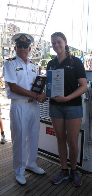 The award is presented to Ms Stewart by the Commanding Officer Lieutenant Commander Andrew Callander. 