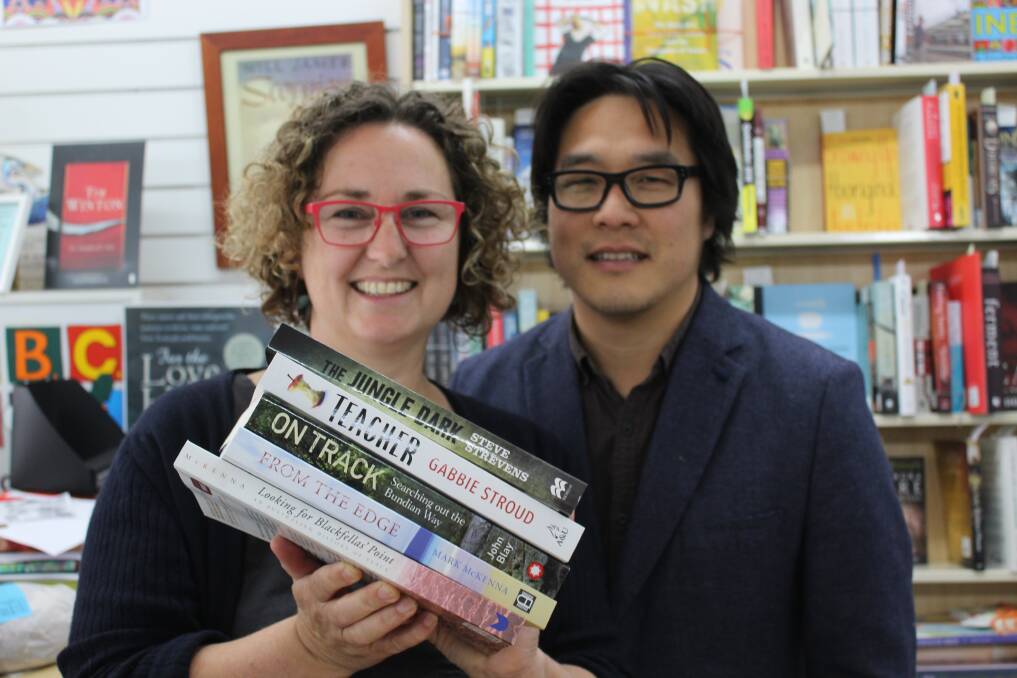 SUPPORTING LOCALS: Candelo Books' Marianna Ypma and Myoung Jae Yi hold some of the books by authors from South East Australia. 