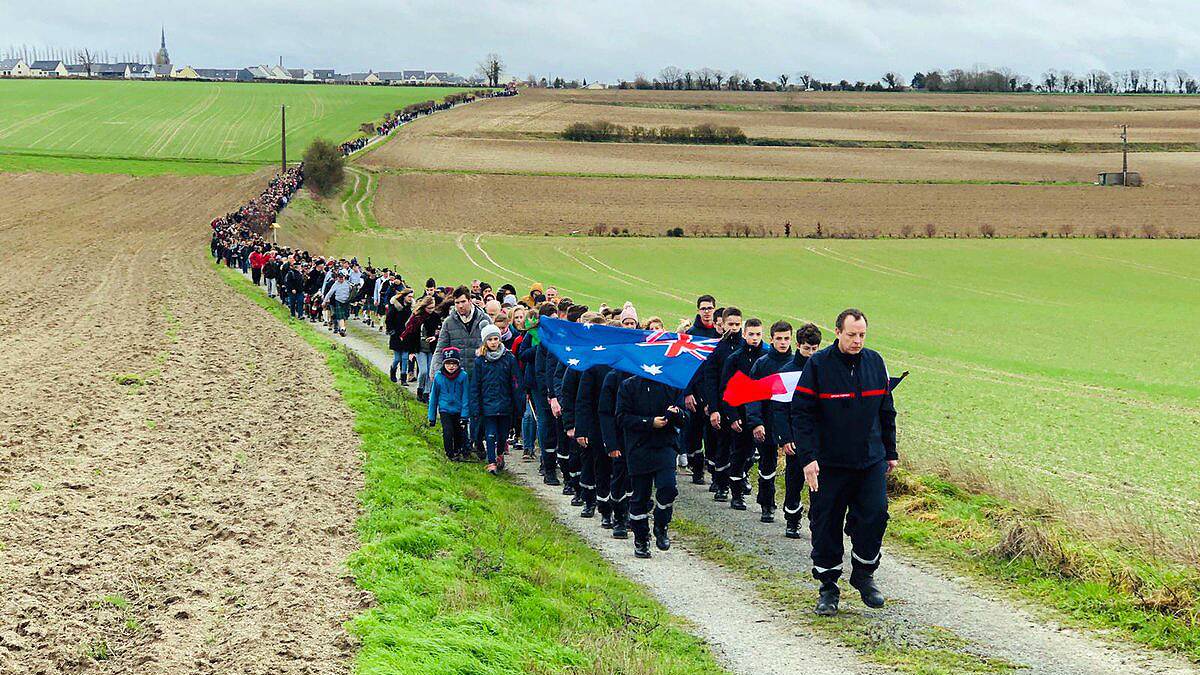 Over 1000 people participated in a solidarity march in Villers-Bretonneux as part of a fundraising campaign for Australia's bushfire recovery. Picture: Sir John Monash Centre and ADF