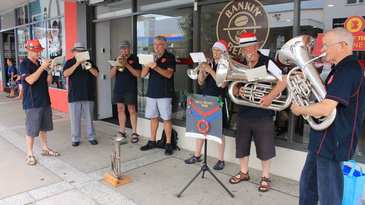 BRINGING IN CHRISTMAS: Members of the Bega District Band perform on the streets of Bega on Tuesday morning. 