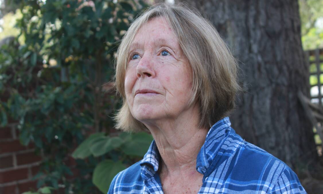SURVIVOR: Jan Reynolds stands in the garden of the house she is living in at Bega. She hopes to rebuild at her Numbugga property. Picture: Albert McKnight 