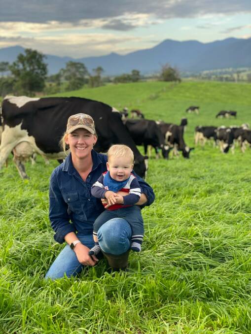 LIFE IN GREEN PASTURES: Bemboka dairy farmer Brodie Game and her son Harry watch cows in the paddock. Picture: Supplied 