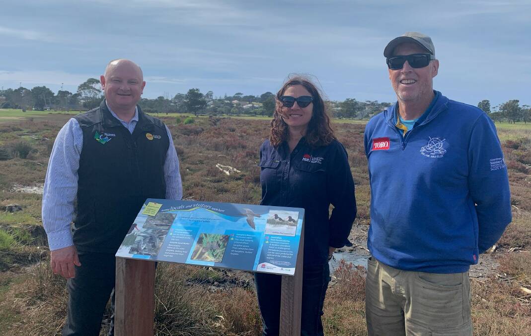 EDUCATING THE COMMUNITY: Bermagui Country Club manager Robert Beuzeville, South East Local Land Service's Sonia Bazzacco and course superintendent Dave Thompson stand next to one of the new signs. Picture: Supplied 