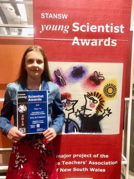 BRILLIANT STUDENT: Amy De Friskbom holds her STANSW Young Scientist Award she received in Wollongong. 