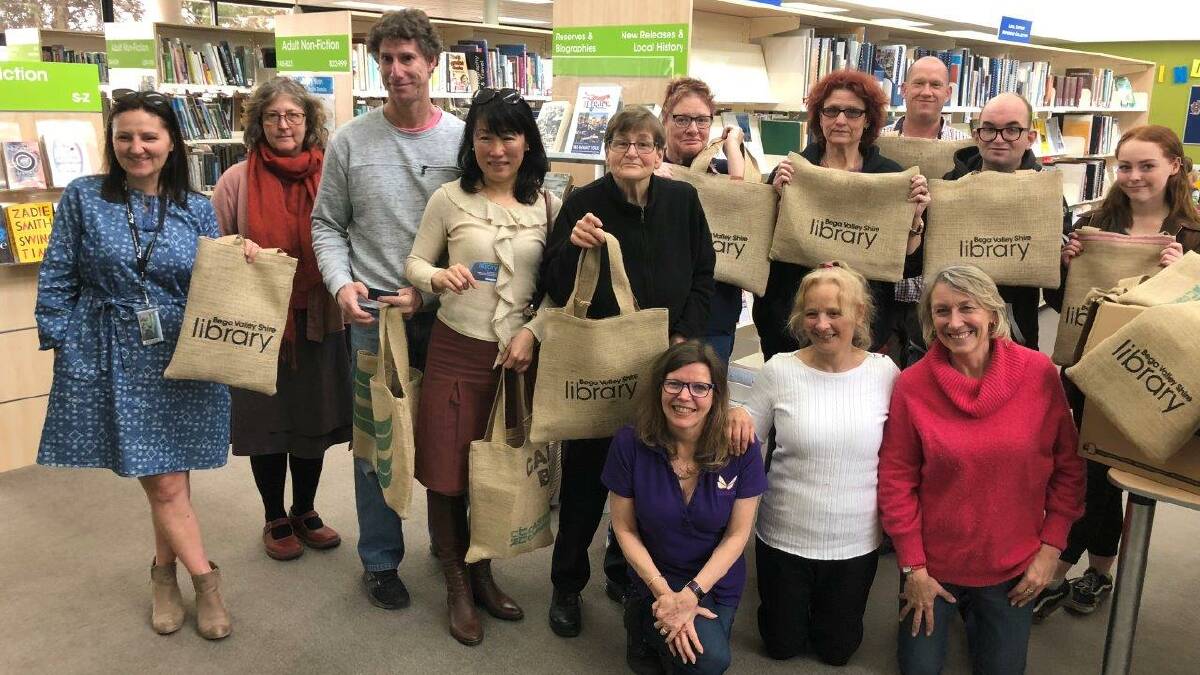 Tulgeen workers and supported employees at the handover of the library bags. 