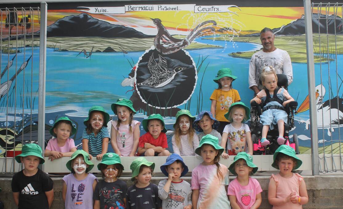 CONNETION TO COUNTRY: Children of the Bermagui Preschool thank artist Dennis Pitt for the mural he created for them. 