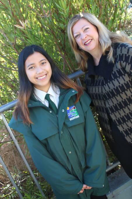CHAMPION STUDENT: Sapphire Coast Anglican College principal Tracey Gray congratulates Neera Sakunthai on winning the outstanding vocational education and training student of the year award. 