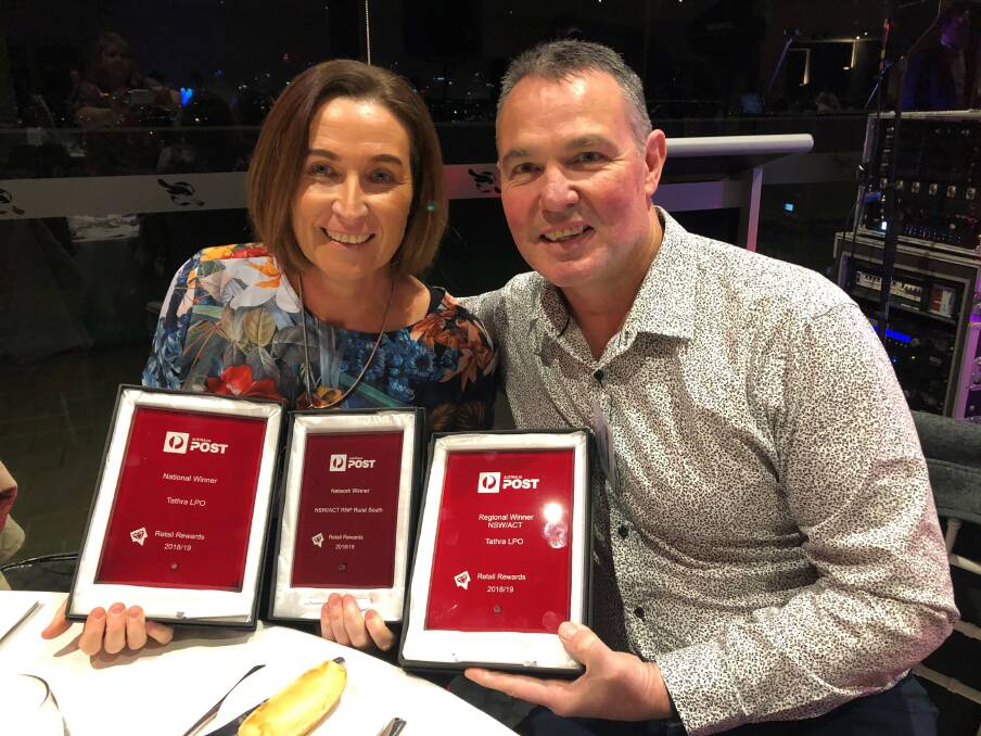 WINNERS: Tathra Post Office's licensees Deb and Ian Alker are all smiles at the Australia Post Licensee Awards night on Saturday.