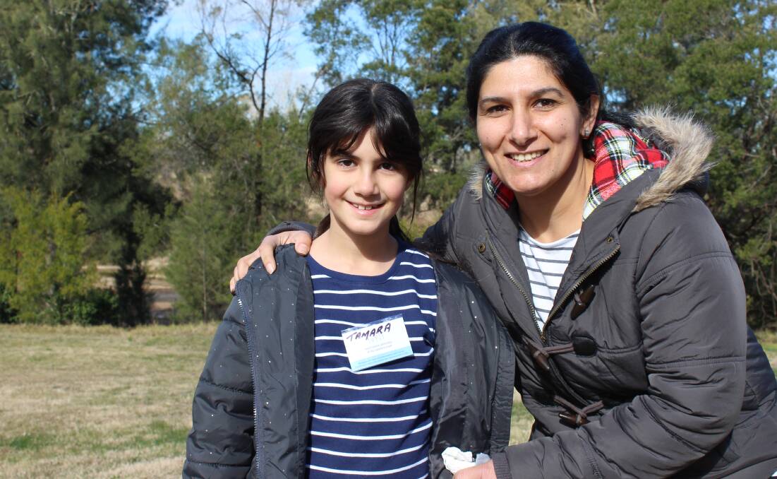 NEW HOME: Tamara Sobi and her mother Vivian Admo visit the Bega Cheese Heritage Centre park for morning tea on Monday. 